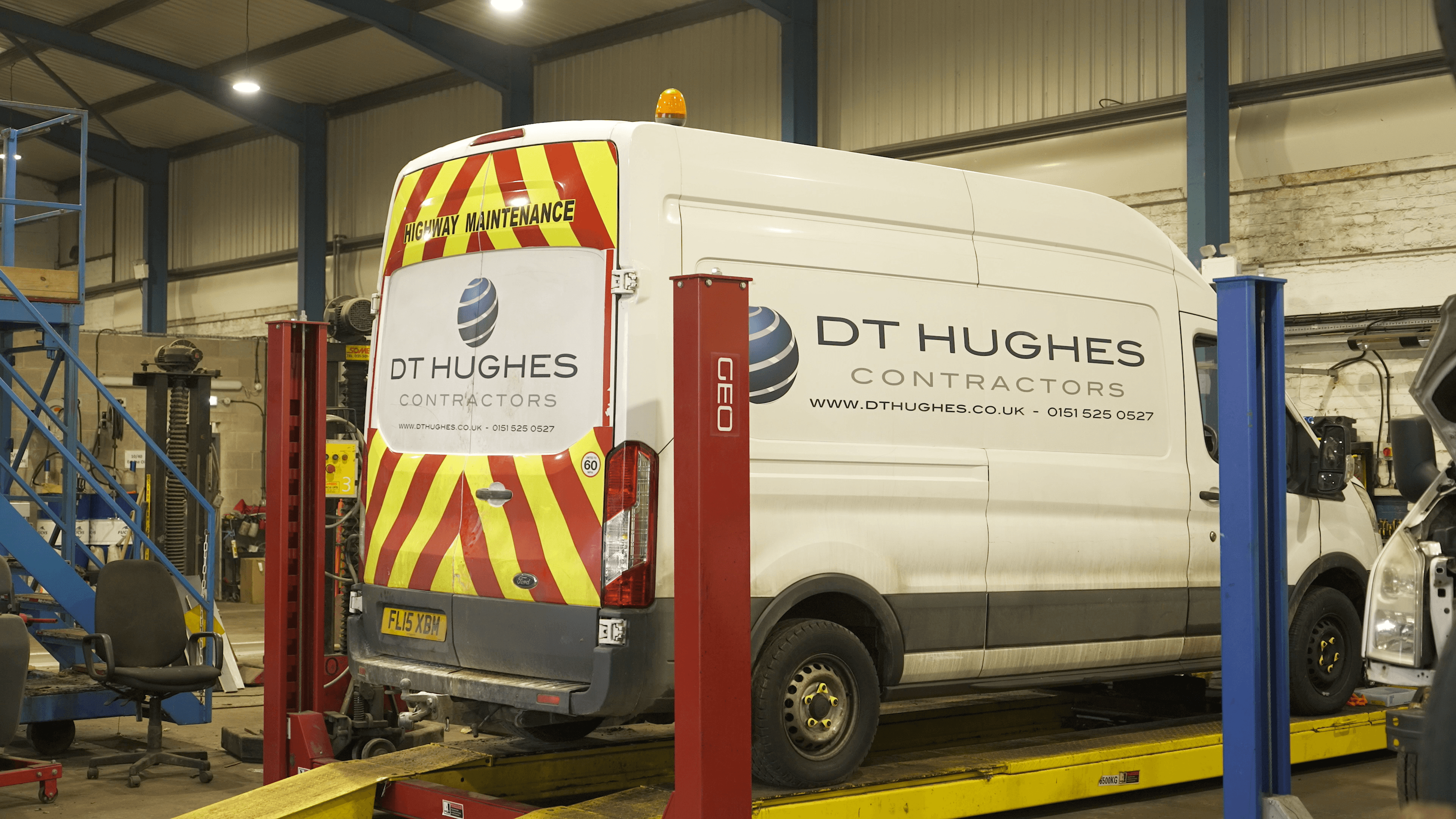 DT Hughes van on a ramp in the commercial garage